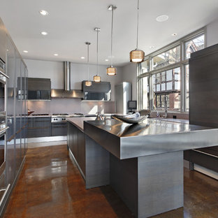 This is an example of a large modern u-shaped separate kitchen in Other with a double-bowl sink, flat-panel cabinets, grey cabinets, zinc benchtops, panelled appliances, concrete floors, with island and brown floor.