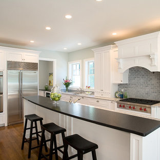 Inspiration for a traditional kitchen in Boston with stainless steel appliances, quartz benchtops, recessed-panel cabinets, white cabinets, blue splashback and slate splashback.
