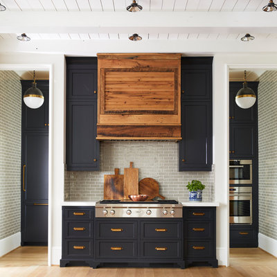 Kitchen - large cottage single-wall light wood floor kitchen idea in Charlotte with a farmhouse sink, marble countertops, gray backsplash, subway tile backsplash, no island, blue cabinets, stainless steel appliances and shaker cabinets