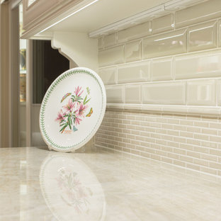 Mid-sized traditional eat-in kitchen designs - Mid-sized elegant u-shaped medium tone wood floor eat-in kitchen photo in Austin with an undermount sink, raised-panel cabinets, white cabinets, quartzite countertops, beige backsplash, mosaic tile backsplash, paneled appliances and an island