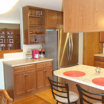 Kitchen Reconfigured to Brightens and Expand Storage