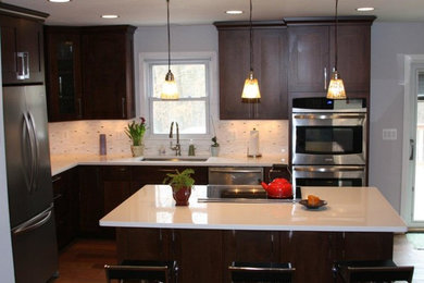 Kitchen - l-shaped kitchen idea in DC Metro with white backsplash and stainless steel appliances