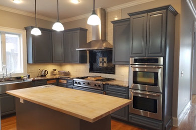 Inspiration for a mid-sized timeless l-shaped medium tone wood floor eat-in kitchen remodel in Nashville with a farmhouse sink, raised-panel cabinets, blue cabinets, wood countertops, white backsplash, subway tile backsplash, stainless steel appliances and an island