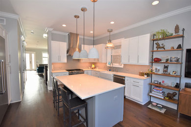 Example of a huge arts and crafts l-shaped dark wood floor and blue floor eat-in kitchen design in Chicago with a drop-in sink, shaker cabinets, white cabinets, quartz countertops, beige backsplash, ceramic backsplash, stainless steel appliances, an island and white countertops