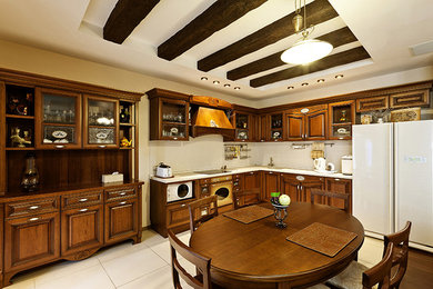 Eat-in kitchen - large 1950s l-shaped ceramic tile and white floor eat-in kitchen idea in Chicago with an undermount sink, beaded inset cabinets, dark wood cabinets, quartz countertops, white backsplash, ceramic backsplash, white appliances, no island and white countertops