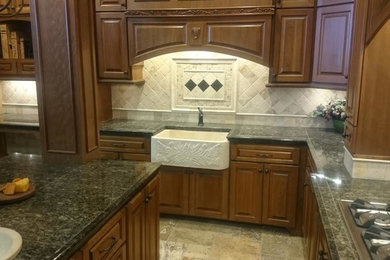 Inspiration for a large timeless l-shaped ceramic tile eat-in kitchen remodel in Baltimore with granite countertops, white backsplash, ceramic backsplash, an island, a drop-in sink, raised-panel cabinets, medium tone wood cabinets and white appliances