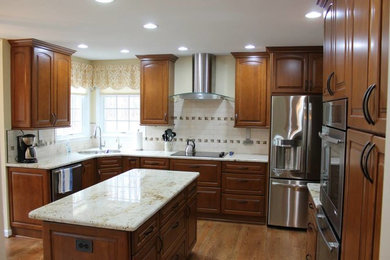 Inspiration for an u-shaped kitchen remodel in DC Metro with an island
