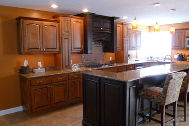 Example of a large u-shaped eat-in kitchen design in Other with raised-panel cabinets and an island