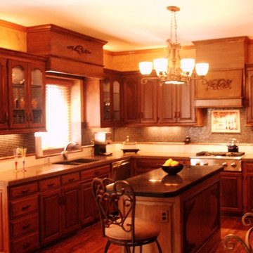 Kitchen Remodel featuring  Faux painted cabinets with bronzed accents.