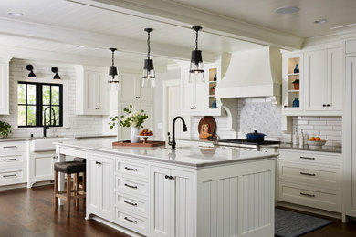 Kitchen - large country l-shaped dark wood floor, brown floor, exposed beam and shiplap ceiling kitchen idea in Minneapolis with a farmhouse sink, white cabinets, quartz countertops, white backsplash, an island, gray countertops, shaker cabinets and subway tile backsplash