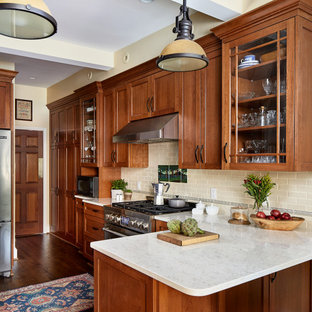 Mid-sized traditional kitchen photos - Inspiration for a mid-sized timeless medium tone wood floor kitchen remodel in DC Metro with medium tone wood cabinets, beige backsplash, subway tile backsplash, stainless steel appliances and white countertops