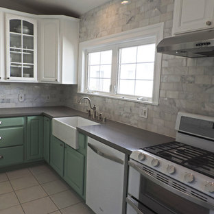 Design ideas for a mid-sized beach style l-shaped separate kitchen in Los Angeles with a farmhouse sink, beaded inset cabinets, green cabinets, quartz benchtops, white splashback, stone tile splashback, white appliances, ceramic floors and no island.