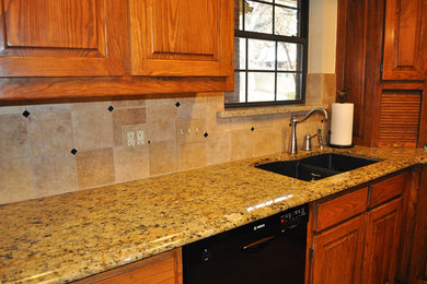 Example of a classic kitchen design in Dallas with granite countertops and ceramic backsplash