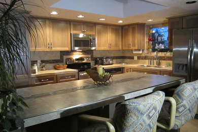 Large arts and crafts l-shaped eat-in kitchen photo in Phoenix with an island