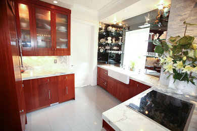 Example of a small trendy eat-in kitchen design in Miami with a farmhouse sink, flat-panel cabinets, brown cabinets and marble countertops