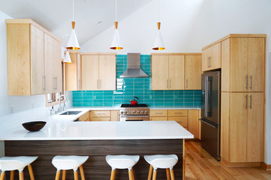 Eat-in kitchen - mid-sized 1960s light wood floor eat-in kitchen idea in Other with a drop-in sink, flat-panel cabinets, medium tone wood cabinets, quartz countertops, blue backsplash, stainless steel appliances, a peninsula, white countertops and subway tile backsplash