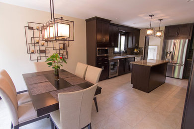 Example of a large transitional u-shaped ceramic tile and beige floor eat-in kitchen design in Detroit with an undermount sink, shaker cabinets, dark wood cabinets, granite countertops, multicolored backsplash, matchstick tile backsplash, stainless steel appliances and an island