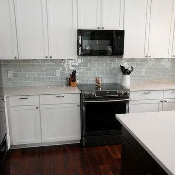 Kitchen Remodel with White Counters, White Cabinets, Subway Tile Backsplash