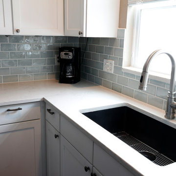 Kitchen Remodel with White Counters, White Cabinets, Subway Tile Backsplash
