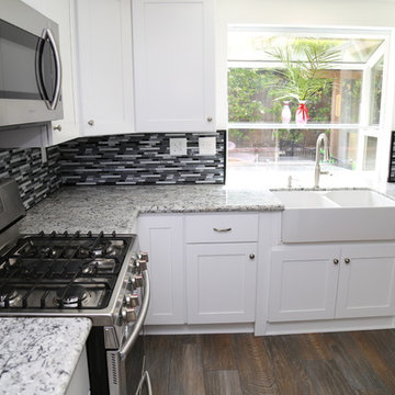 Kitchen Remodel with White Shaker Style Cabinets and Granite