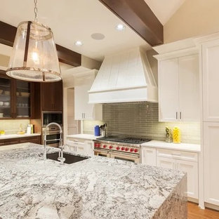 Mid-sized transitional kitchen photos - Mid-sized transitional l-shaped light wood floor and beige floor kitchen photo in Los Angeles with an undermount sink, recessed-panel cabinets, white cabinets, granite countertops, green backsplash, ceramic backsplash, paneled appliances, an island and multicolored countertops