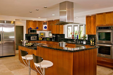 Trendy eat-in kitchen photo in Hawaii with an undermount sink, medium tone wood cabinets, black backsplash and stainless steel appliances