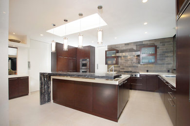Kitchen - mid-sized modern u-shaped porcelain tile and beige floor kitchen idea in San Diego with a single-bowl sink, flat-panel cabinets, brown cabinets, quartz countertops, gray backsplash, porcelain backsplash, stainless steel appliances, an island and beige countertops