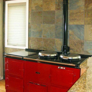 Inspiration for a contemporary kitchen in Calgary with granite benchtops, grey splashback, slate splashback, coloured appliances, light hardwood floors and brown floor.
