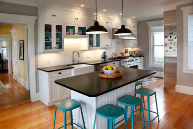 Kitchen - kitchen idea in Boston with white cabinets, granite countertops, white backsplash and ceramic backsplash