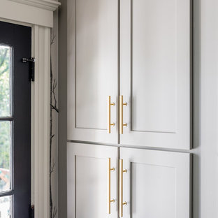 Small modern eat-in kitchen photos - Inspiration for a small modern galley slate floor eat-in kitchen remodel in Boston with an undermount sink, white cabinets, marble countertops, white backsplash, subway tile backsplash, stainless steel appliances and an island