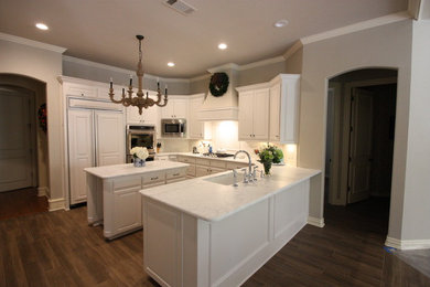 Inspiration for a large transitional ceramic tile kitchen remodel in Dallas with marble countertops and an island