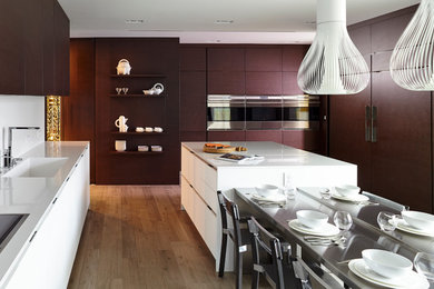 Example of a trendy kitchen design in Miami with paneled appliances