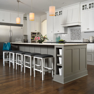 Eat-in kitchen - mid-sized contemporary l-shaped dark wood floor and brown floor eat-in kitchen idea in Providence with a farmhouse sink, shaker cabinets, white cabinets, quartzite countertops, white backsplash, subway tile backsplash, stainless steel appliances and an island
