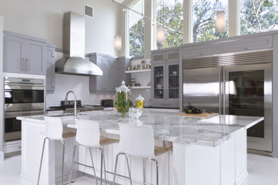 Example of a trendy kitchen design in Orlando with shaker cabinets, stainless steel appliances, marble countertops, gray cabinets and gray countertops