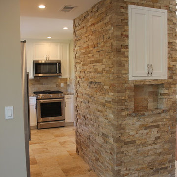 Kitchen; Stacked Stone on chimney with built in bar cabinet