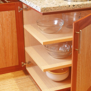 This is an example of a mid-sized contemporary galley eat-in kitchen in San Diego with a drop-in sink, flat-panel cabinets, light wood cabinets, concrete benchtops, coloured appliances, bamboo floors and with island.