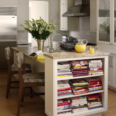 Eat-in kitchen - mid-sized traditional l-shaped light wood floor eat-in kitchen idea in New York with shaker cabinets, white cabinets, white backsplash, mosaic tile backsplash, stainless steel appliances, a farmhouse sink, granite countertops and an island