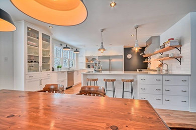 Mid-sized transitional l-shaped eat-in kitchen photo in Burlington with quartz countertops