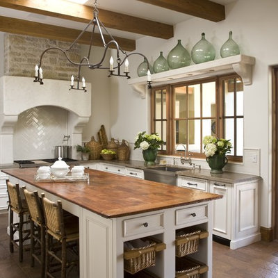 Elegant kitchen photo in Phoenix with a farmhouse sink and wood countertops
