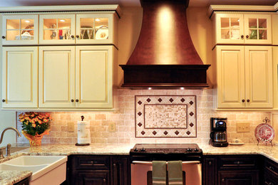 Example of a kitchen design in DC Metro with beaded inset cabinets, white cabinets and beige backsplash