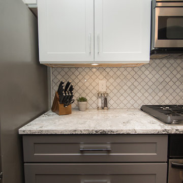 Kitchen | Two-Tone Cabinets | Cambria Quartz | Arabesque Marble Backsplash