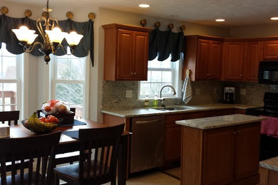 This is an example of a medium sized traditional u-shaped kitchen in Other.