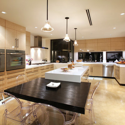 Eat-in kitchen - eat-in kitchen idea in Orange County with flat-panel cabinets and light wood cabinets