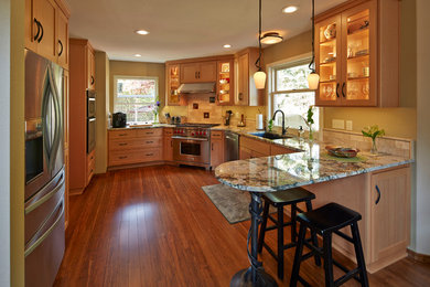 Bamboo floor kitchen photo in Other with granite countertops