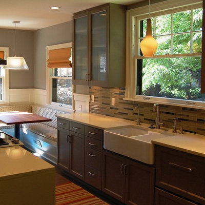 Inspiration for a small transitional enclosed kitchen remodel in Portland with a farmhouse sink, recessed-panel cabinets, gray cabinets, quartz countertops, glass tile backsplash, stainless steel appliances and an island