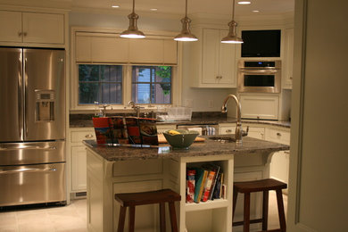 Inspiration for a mid-sized l-shaped beige floor eat-in kitchen remodel in Other with beaded inset cabinets, white cabinets, stainless steel appliances and an island