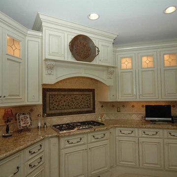 Kitchen with hood and backlit cabinets.
