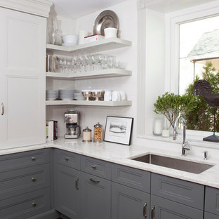 Mid-sized transitional eat-in kitchen ideas - Example of a mid-sized transitional u-shaped dark wood floor eat-in kitchen design in Philadelphia with an undermount sink, recessed-panel cabinets, gray cabinets, quartzite countertops, white backsplash, ceramic backsplash, paneled appliances and an island