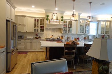 Inspiration for a large timeless l-shaped eat-in kitchen remodel in Raleigh with raised-panel cabinets, white cabinets, granite countertops, white backsplash, subway tile backsplash, an island and white countertops