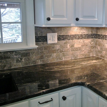 Kitchen with White Cabinets and Black Granite